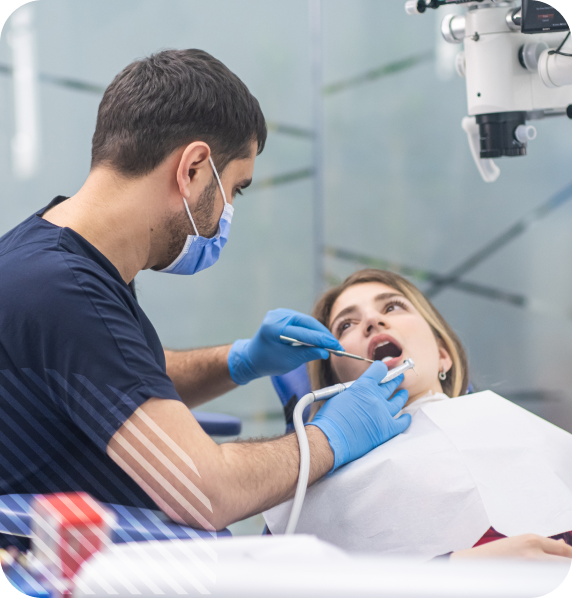 Dentist performing a dental procedure on a patient in a modern clinic.